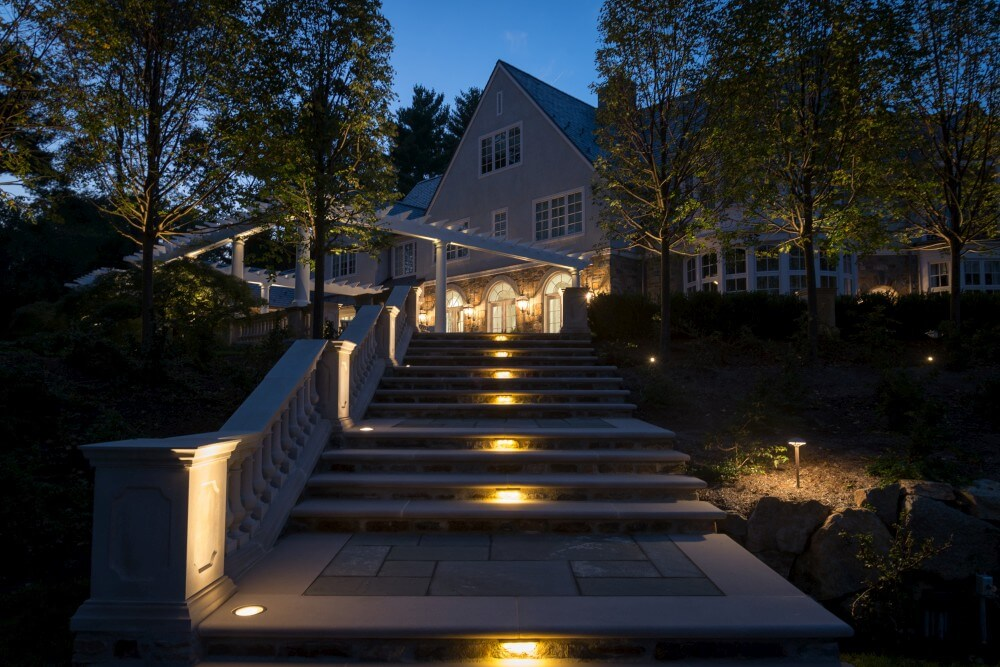 centered pathway lights going up stairs at night.